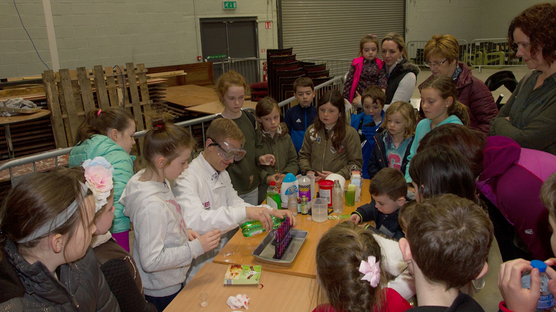 File:Scientist demonstrates experiments at a science fair.jpg