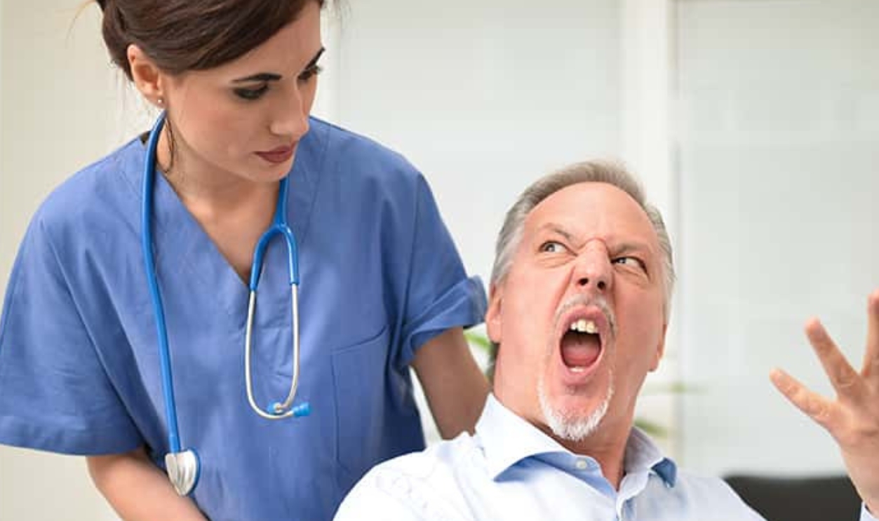 Disabled Patient Screaming To A Nurse, Shutterstock, 455278243