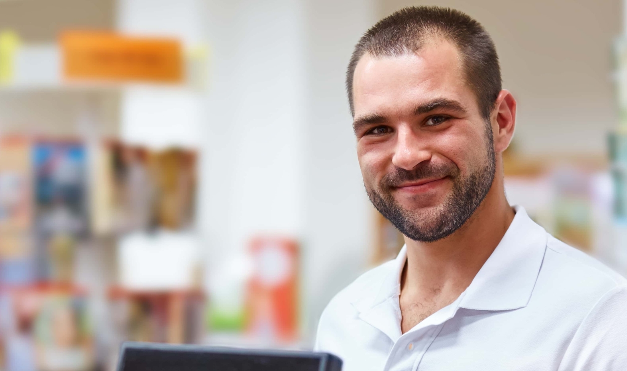 Young Salesman At The Checkout In A Bookstore, Shutterstock, 245566999