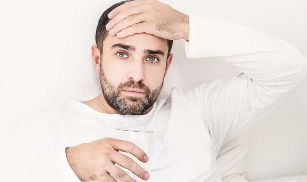 Man With Glass Of Water Lying On The Bed, Shutterstock, 186316559