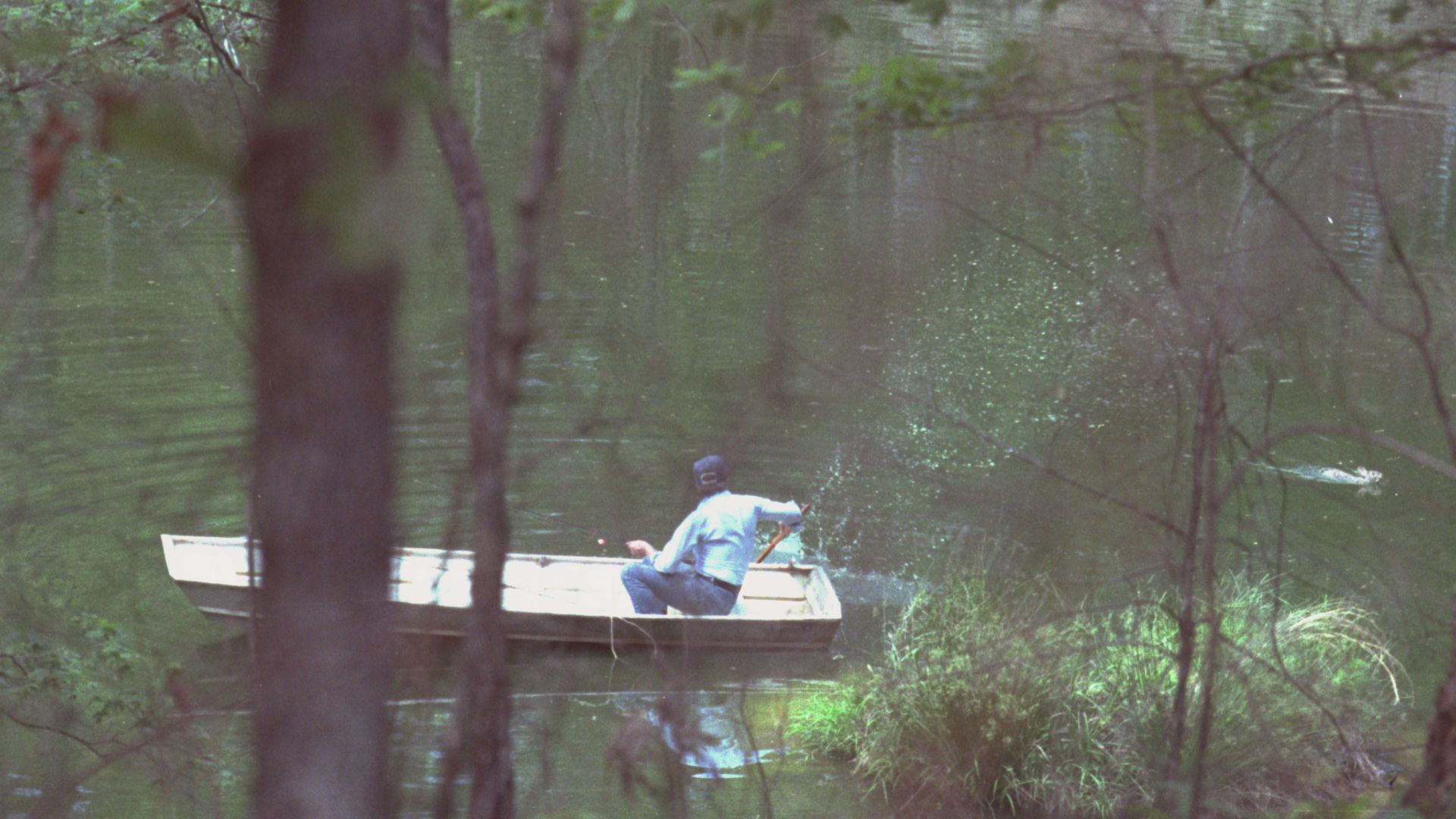 File:Jimmy Carter in boat chasing away swimming rabbit, Plains, Georgia - 19790420.jpg
