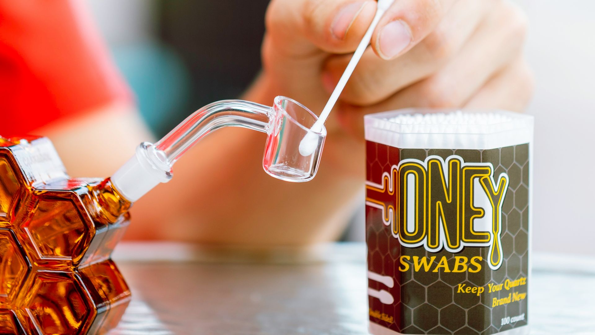 person holding white and red disposable cup