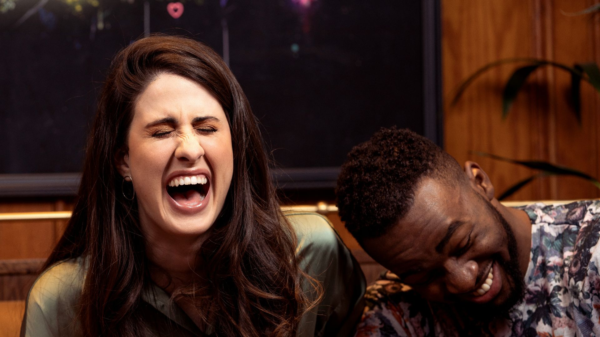 a group of people sitting around a table with drinks