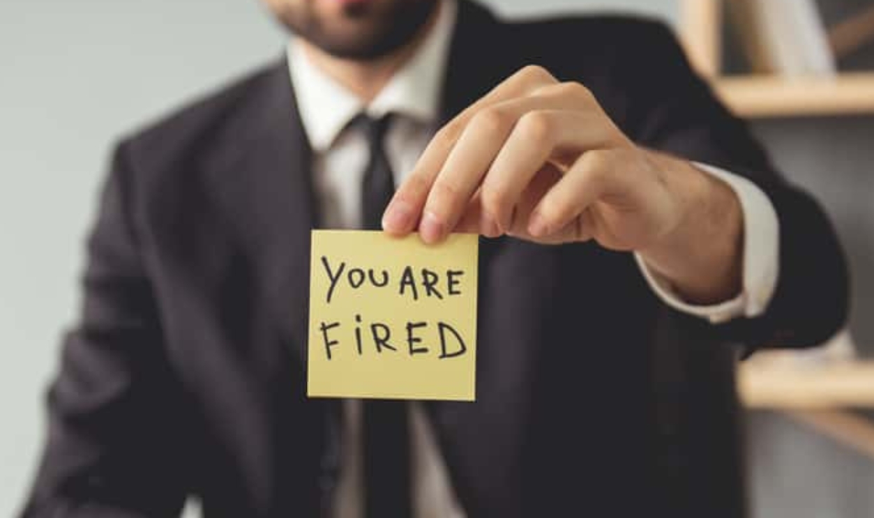 Boss Holding A Note You Are Fired, Shutterstock, 588275405