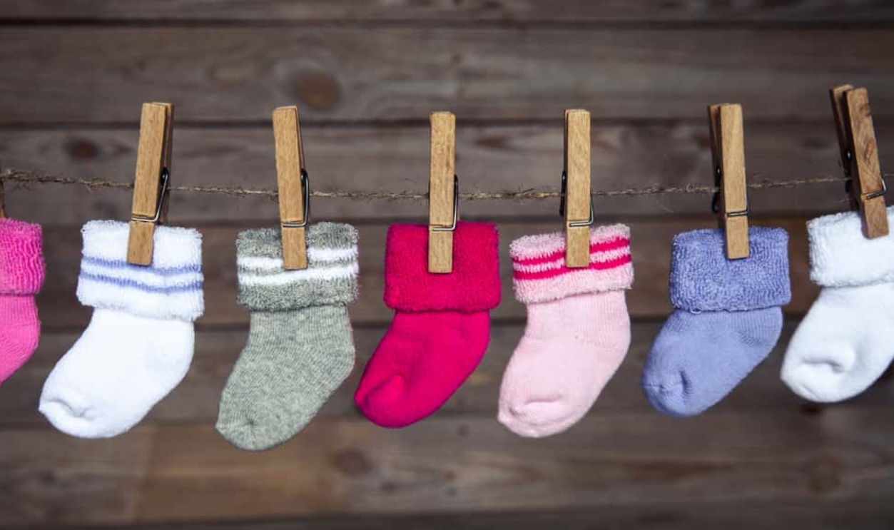 Knitted Socks On A Wooden Background, Shutterstock, 253774627