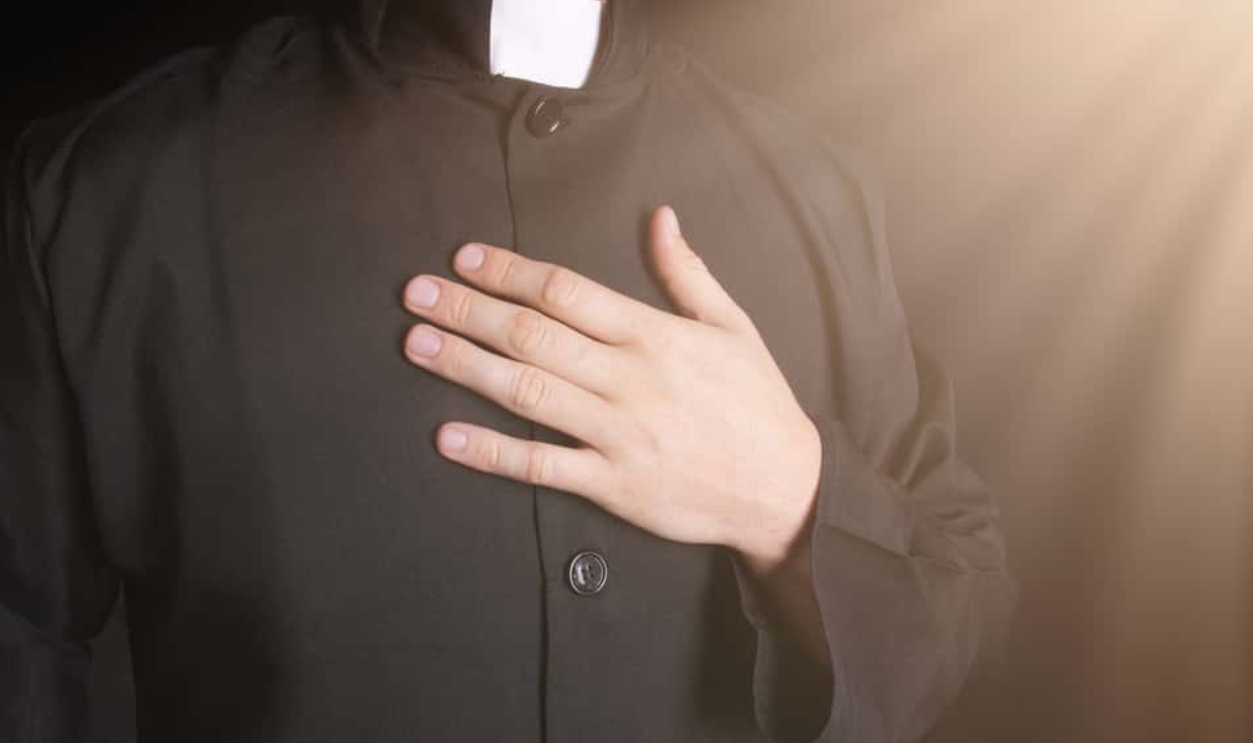 Praying Priest, Shutterstock, 475095466