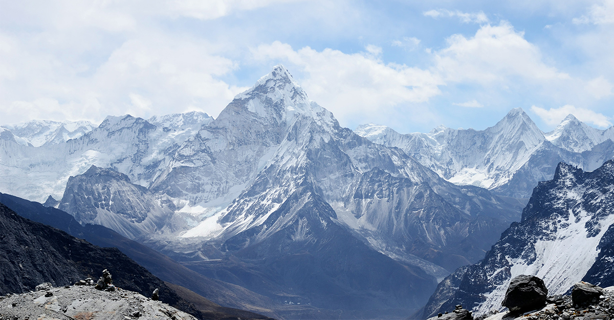 What has roots that nobody sees, and is taller than trees. Up, up it goes, and yet it never grows. What is it?