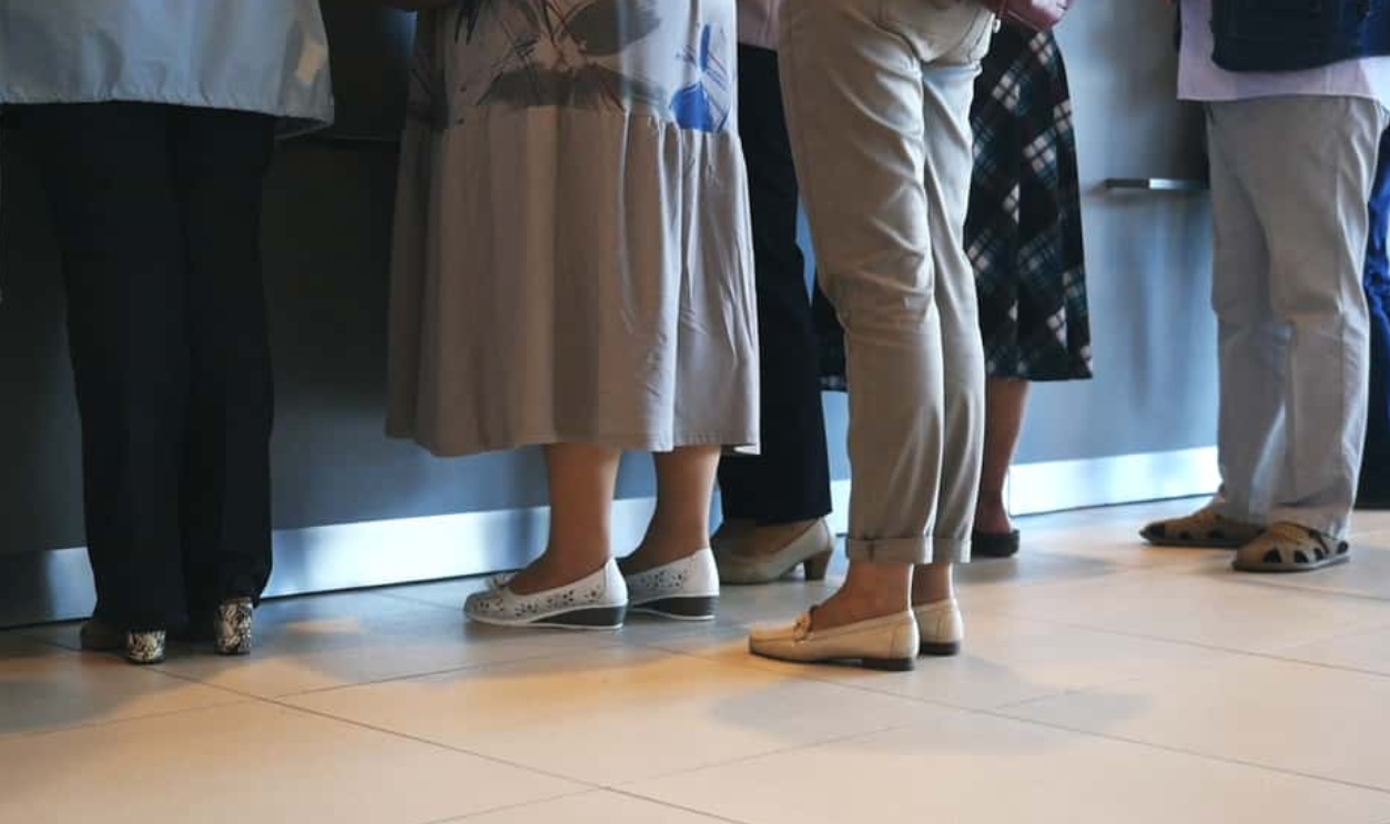 Women And Man Waiting In Queue, Shutterstock, 1471768712