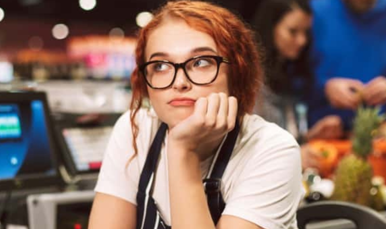 Young Boring Cashier, Shutterstock, 1161693544