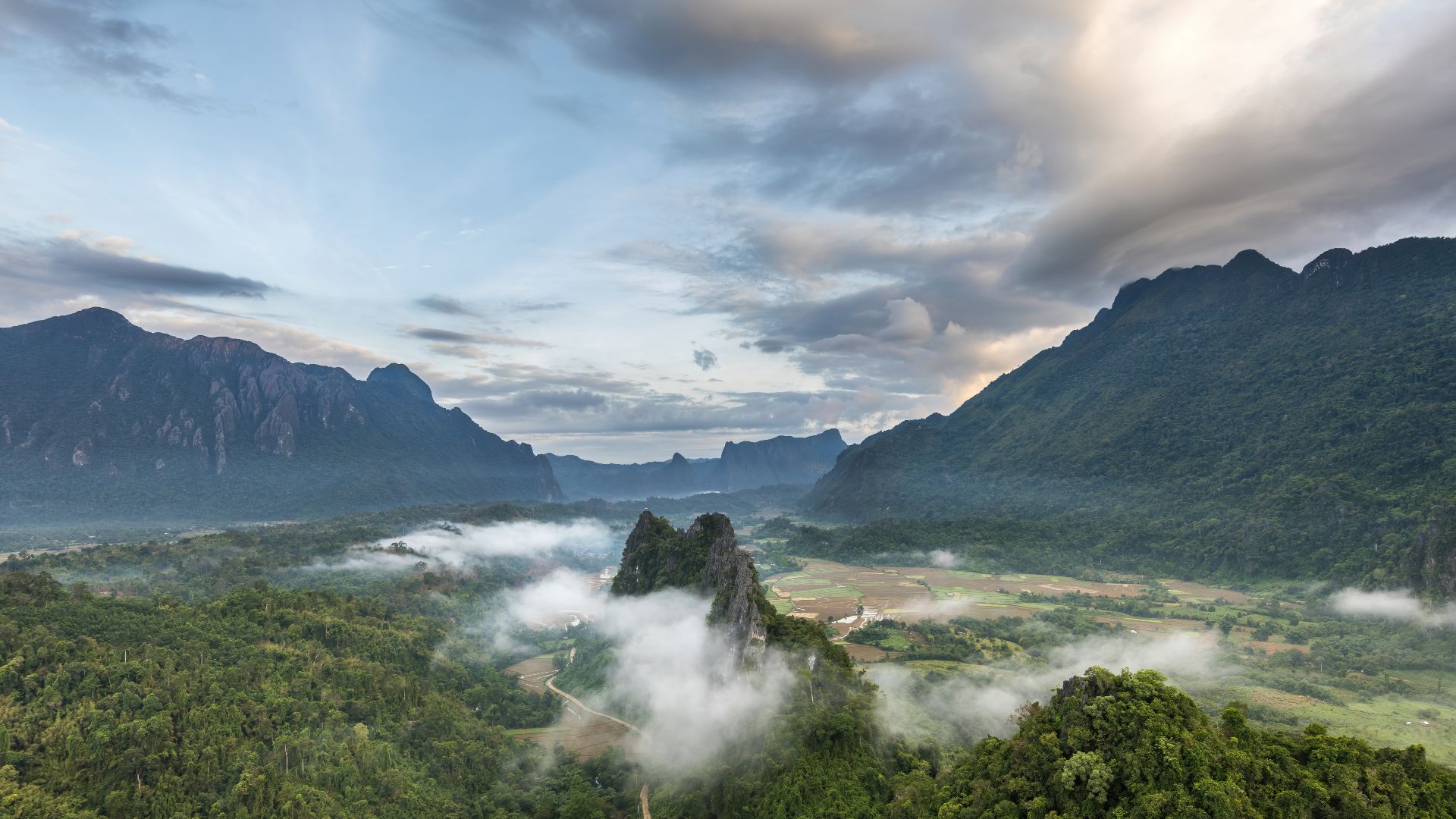 File:Karst peaks mist and colorful clouds at sunrise seen from Mount Nam Xay in Vang Vieng Laos.jpg