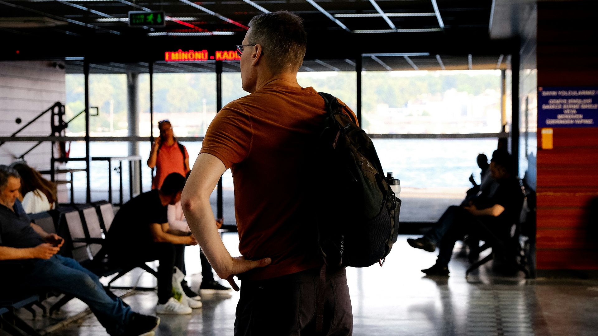 a man standing in front of a screen
