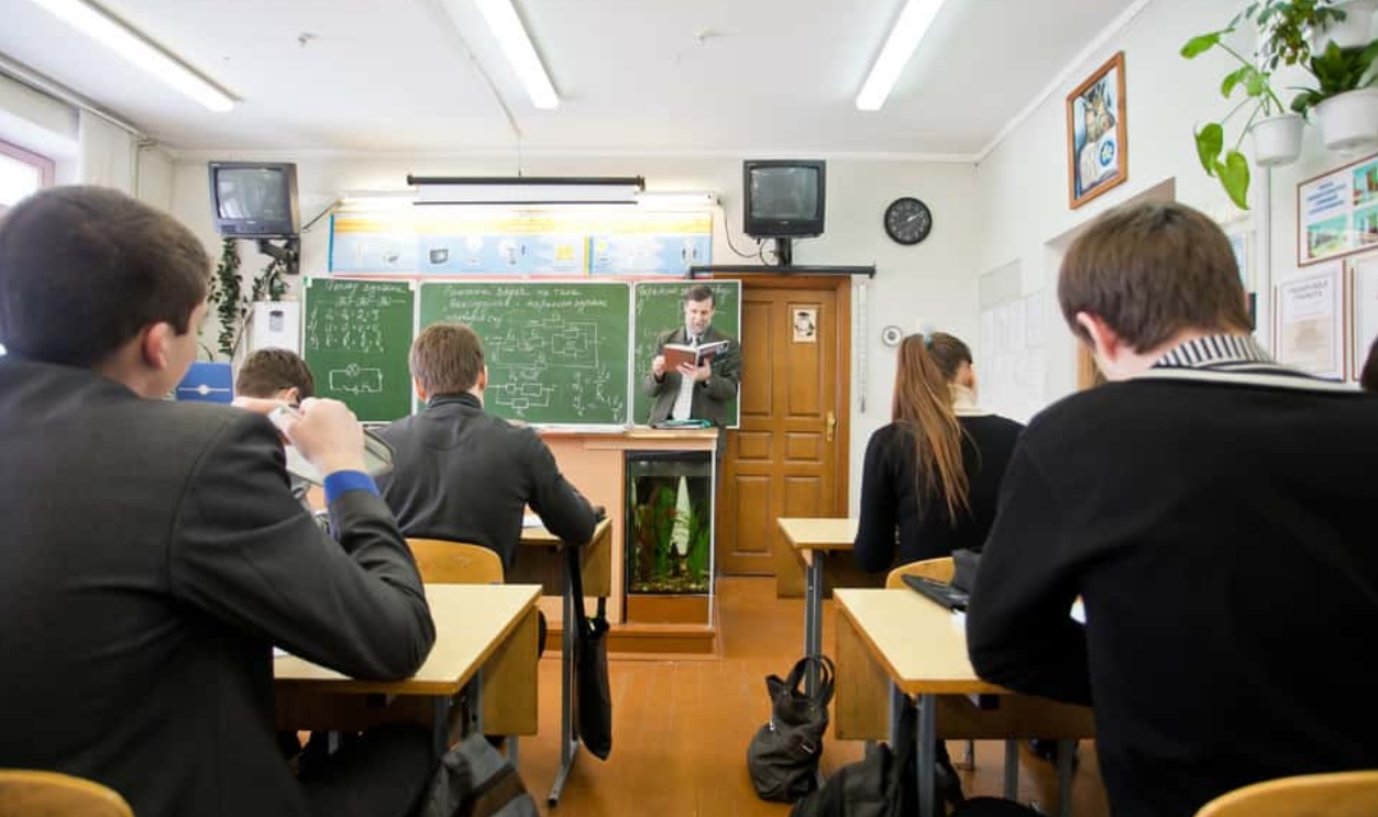 Teacher Reading, Shutterstock, 1185397435