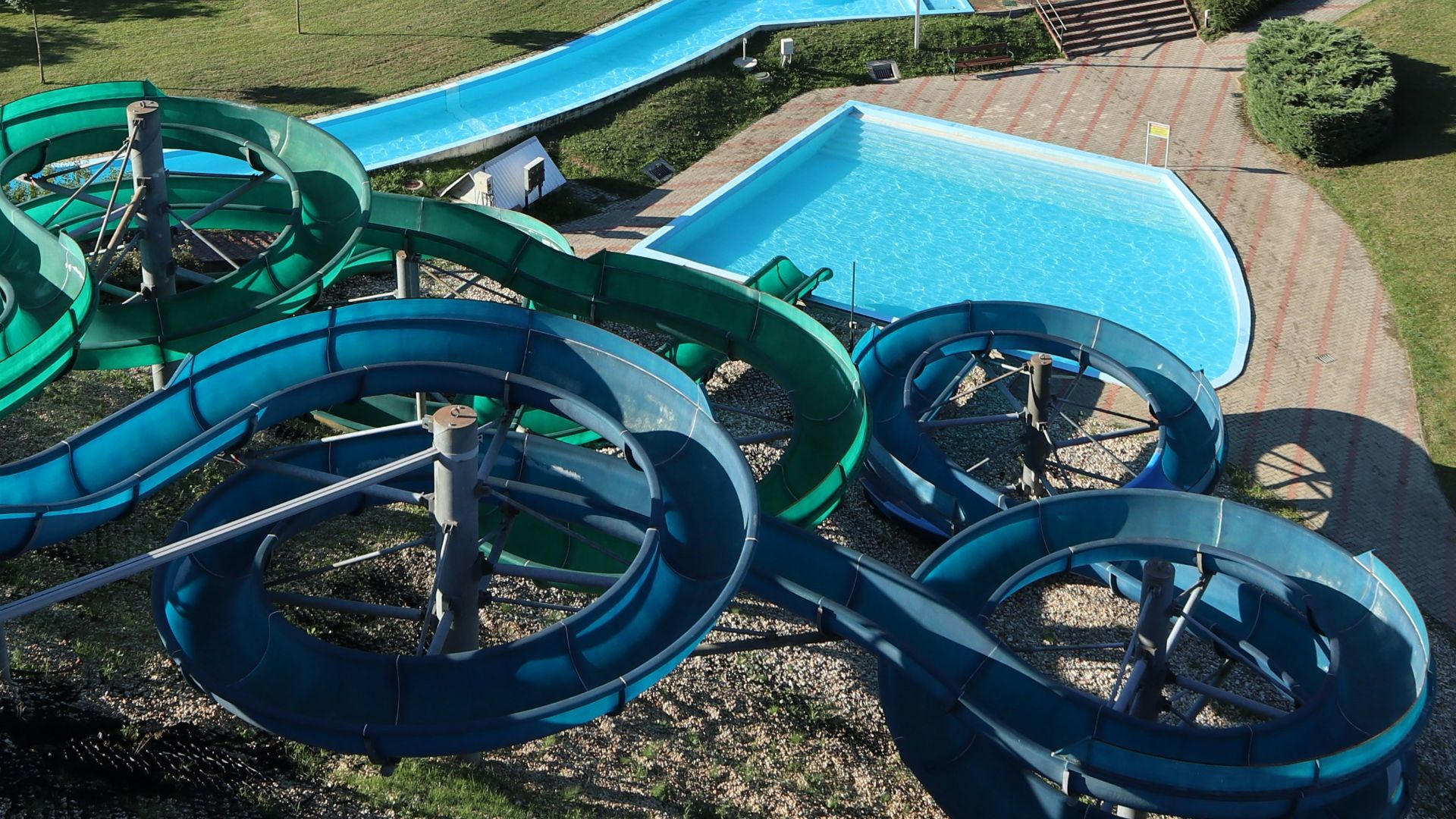 An aerial view of a water park with a water slide