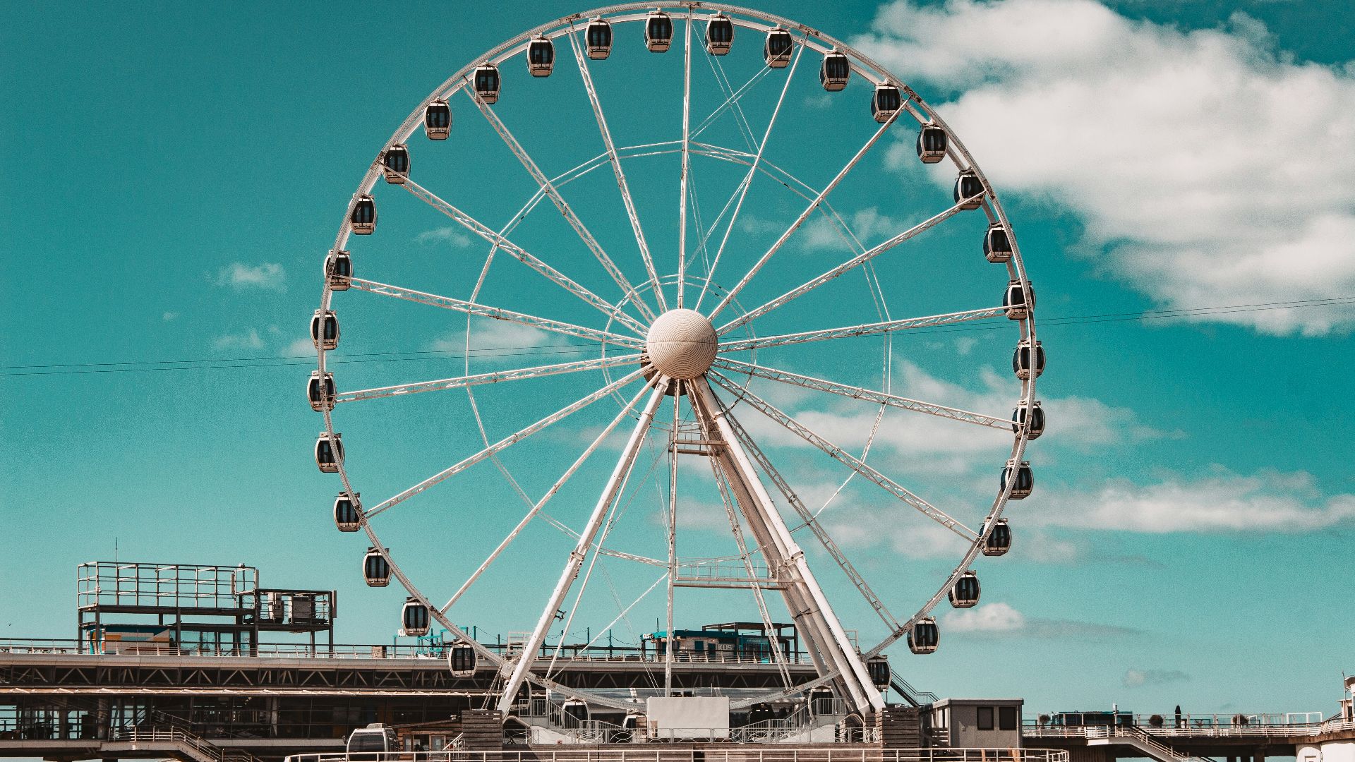 a ferris wheel sitting on top of a pier