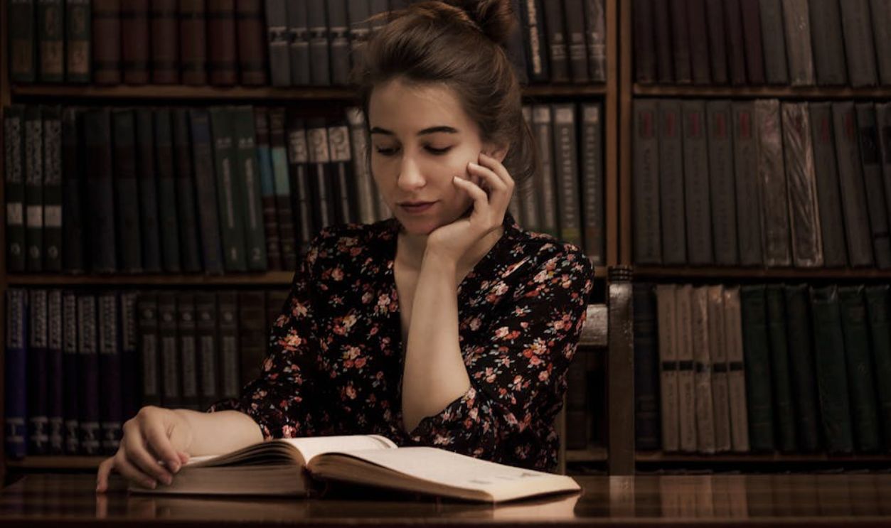 Woman reading a old book