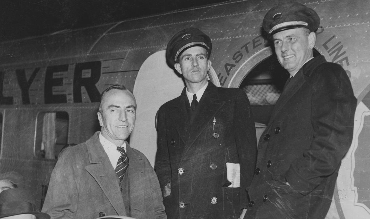 Gettyimages - 104714921, Rickenbacker And Crew Captain Eddie Rickenbacker (1890-1973) with his co-pilot E. R. Brown and Erlon H. Parker after their aircraft had landed at Newark Airport, New Jersey, USA, 13 November 1934. Rickenbacker had completed a 2,390-mile New York to Miami round trip in 17 hours and 18 minutes. 