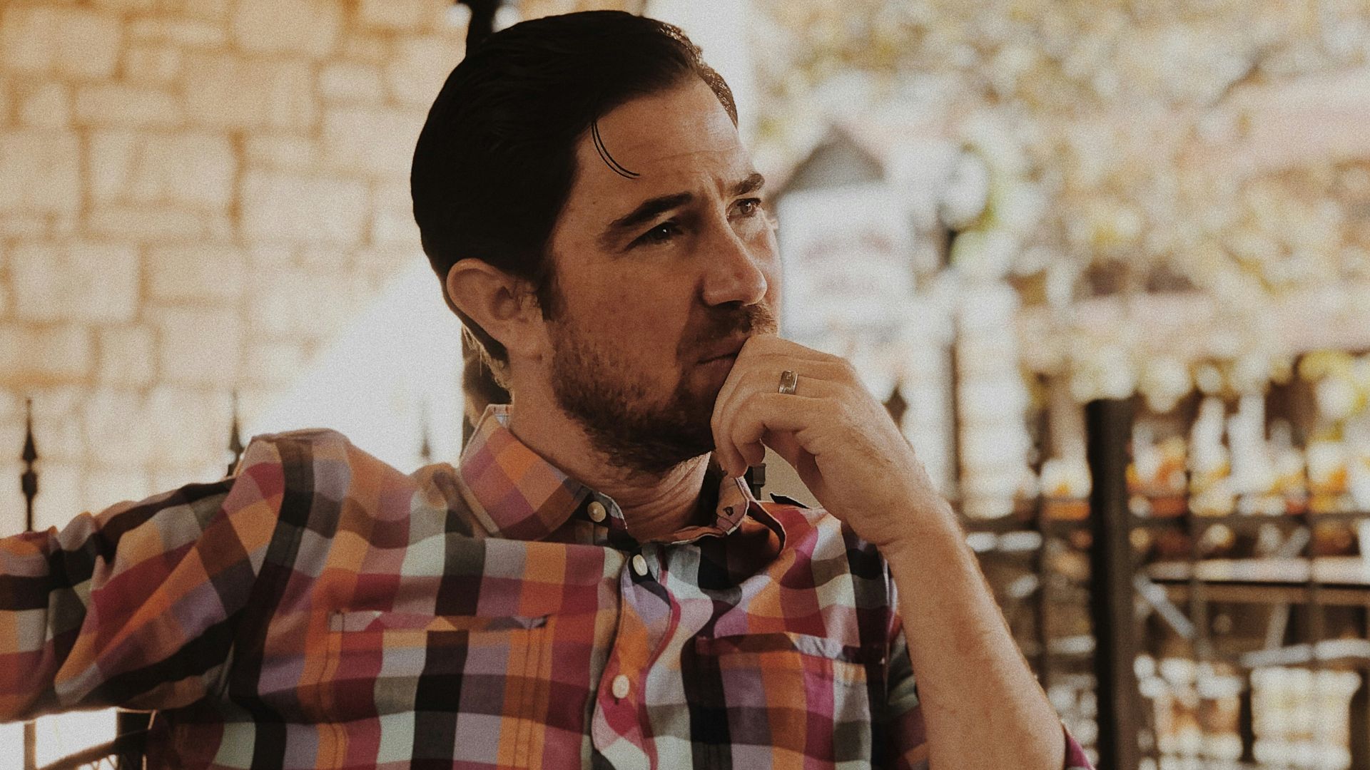 man in red and black plaid dress shirt