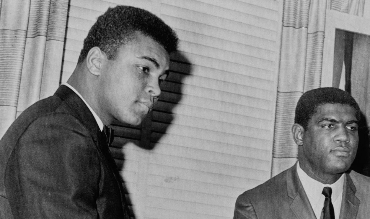 Heavyweight boxers Muhammad Ali (1942 - 2016) and Ernie Terrell (1939 - 2014) receive congratulatory handshakes from Joe Triner, chairman of the Illinois Athletic Commission, in Chicago, February 8th 1966. The Commission approved their upcoming heavyweight championship fight in Chicago on March 29th.