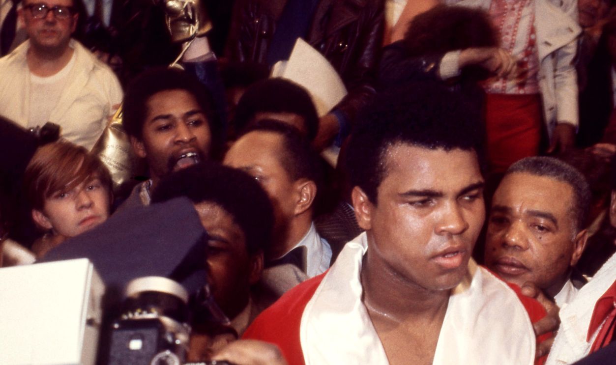 (L-R) American businessman Jabir Herbert Muhammad (1929 - 2008) (behind Ali), American heavyweight boxing champion Muhammad Ali (1942 - 2016) and assistant trainer Drew Bundini Brown (1928 - 1987) walk out of the ring after the 'Fight of the Century' bout against Joe Frazier at Madison Square Garden, New York, New York, March 8, 1971. Frazier won a decision after 15 rounds. For Ali, who was stripped of his title for his political views, this was his first actual career loss in the ring.