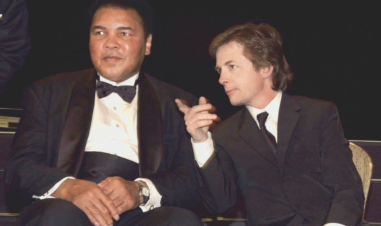 Former boxer Muhammad Ali (L) & actor Michael J. Fox, both Parkinson's disease sufferers, attending the Celebrity Fight Night.