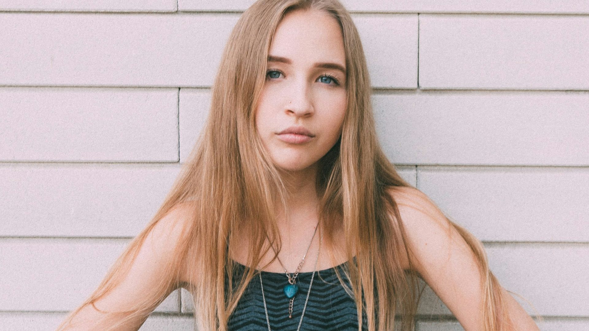 woman in black and white spaghetti strap top