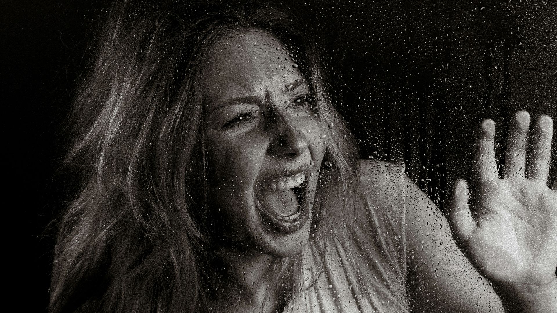 A woman screams in horror.