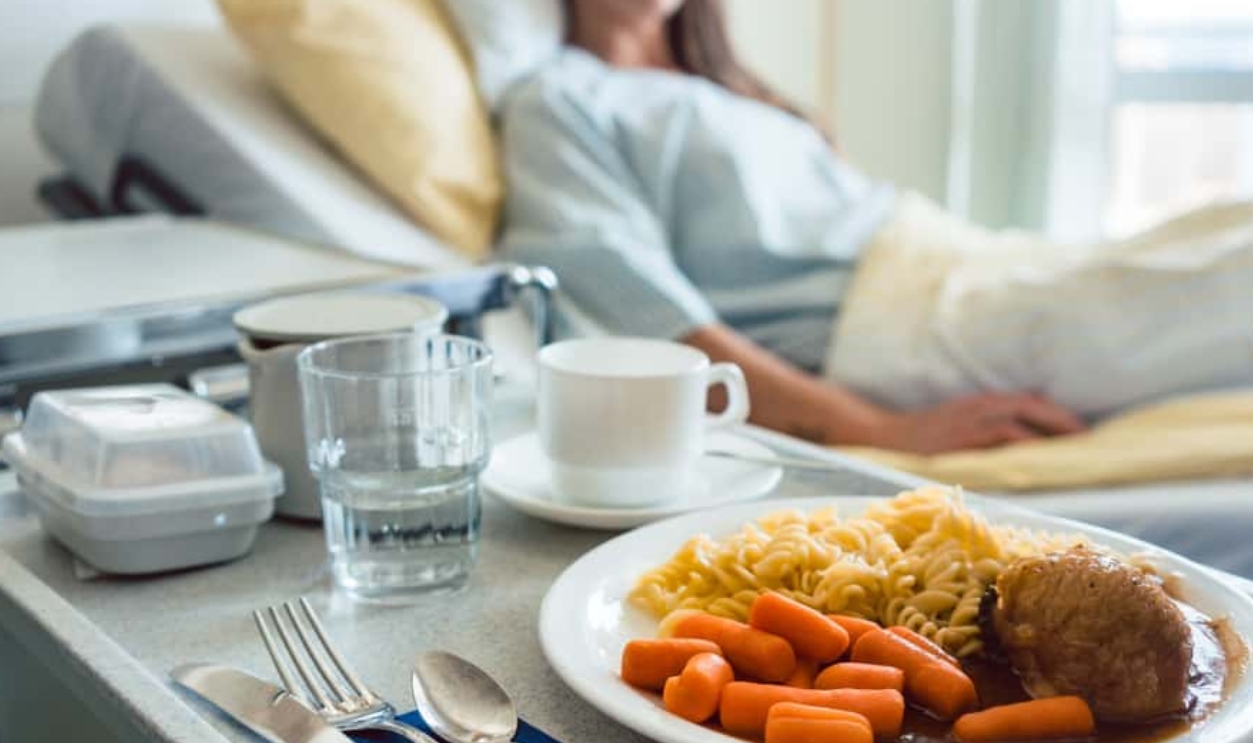 Food Delivered To A Patient In Hospital Bed, Shutterstock, 1415658170
