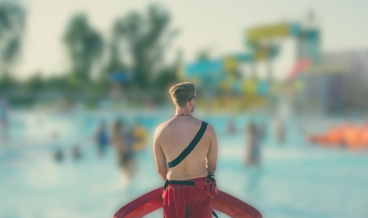 Man Standing In Front Of A Pool