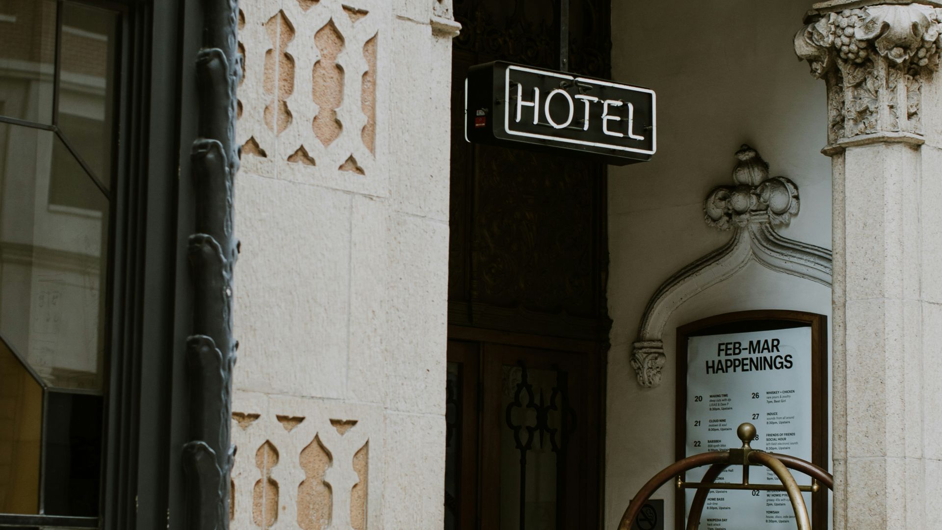 brown trolley under Hotel sign