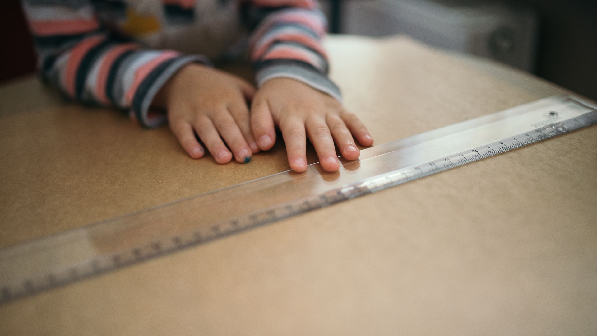 File:A child's hand on a plastic ruler.jpg