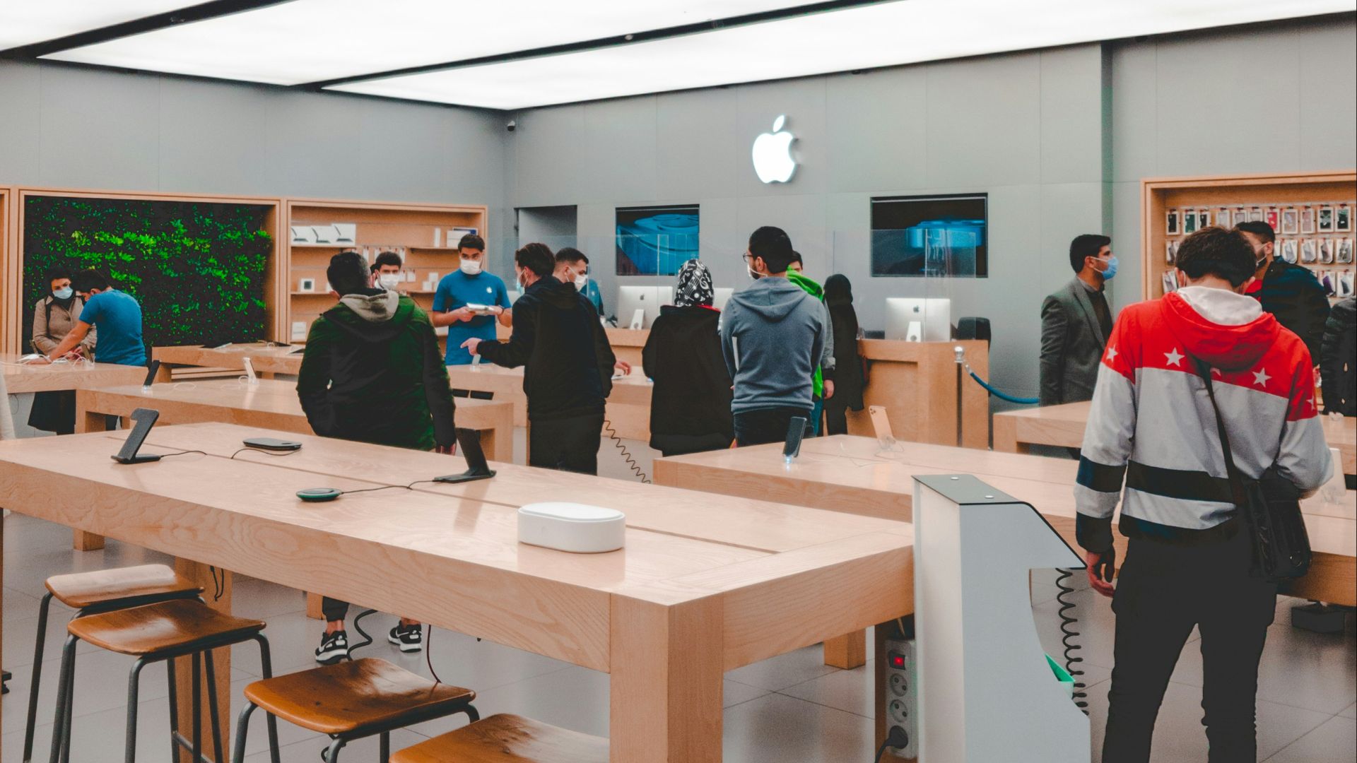 people standing and sitting inside room