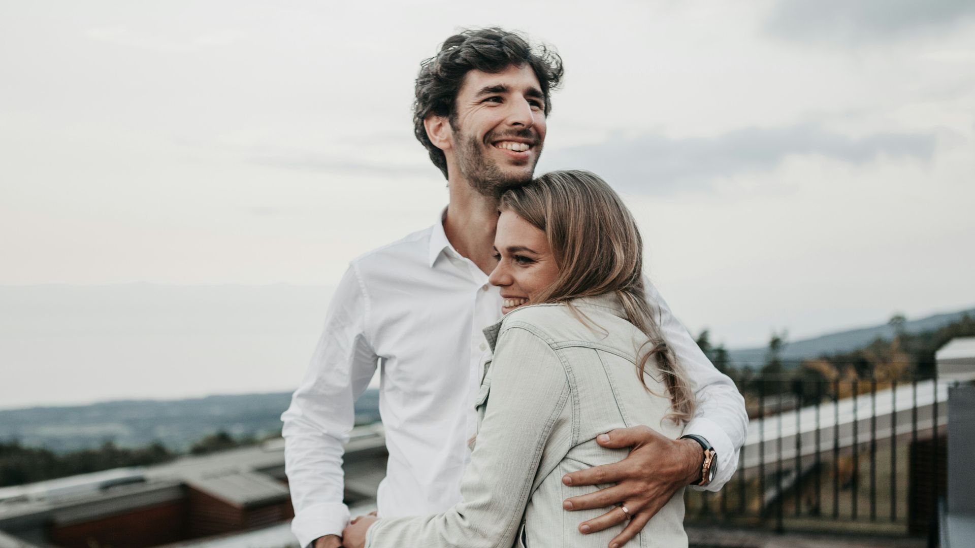 man and woman hugging each other