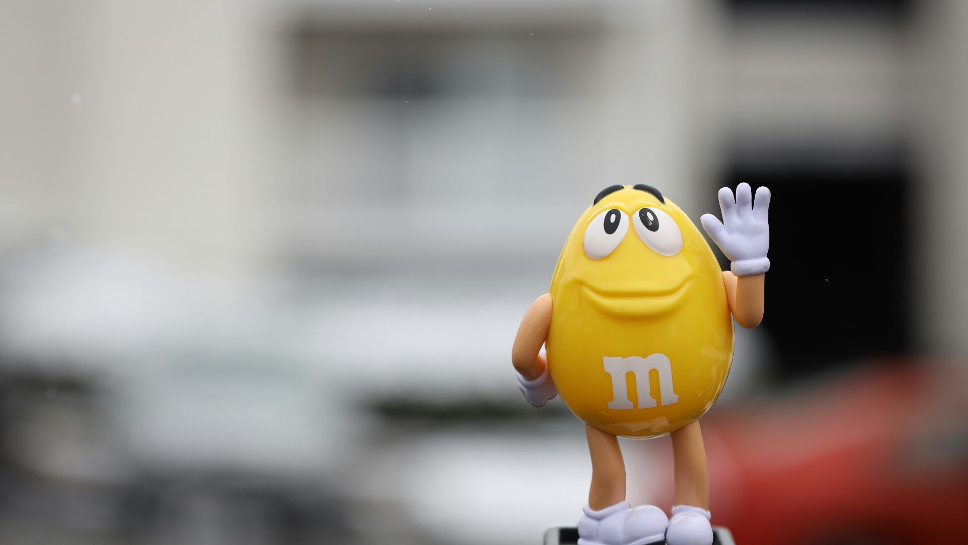 yellow m ms figurine