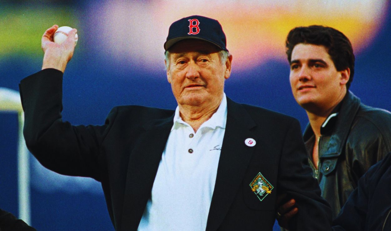 Gettyimages - 51684739, This file photo shows baseball Hall of Famer and f FLUSHING, : This file photo shows baseball Hall of Famer and former Boston Red Sox player Ted Williams, with his son John Henry Williams (R) at his side, throwing out the first pitch during pre-game ceremonies at
