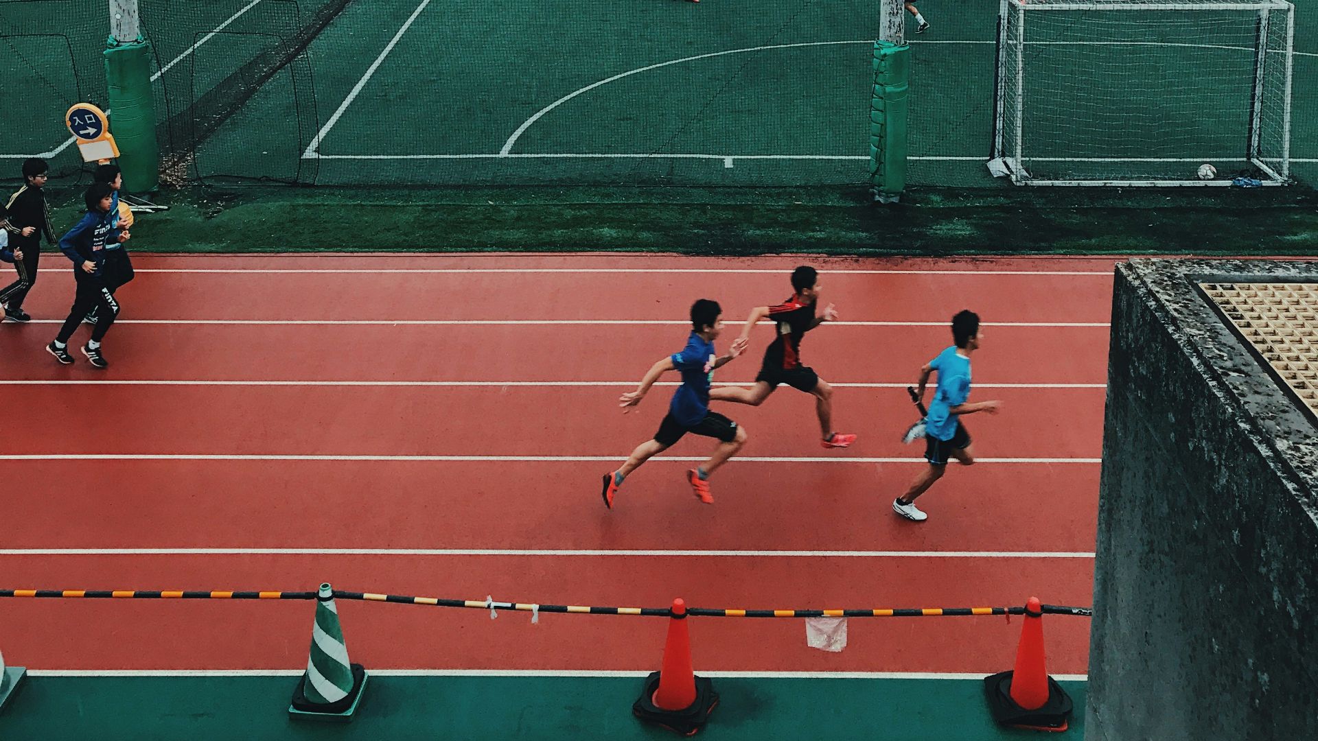 people on field doing sports at daytime