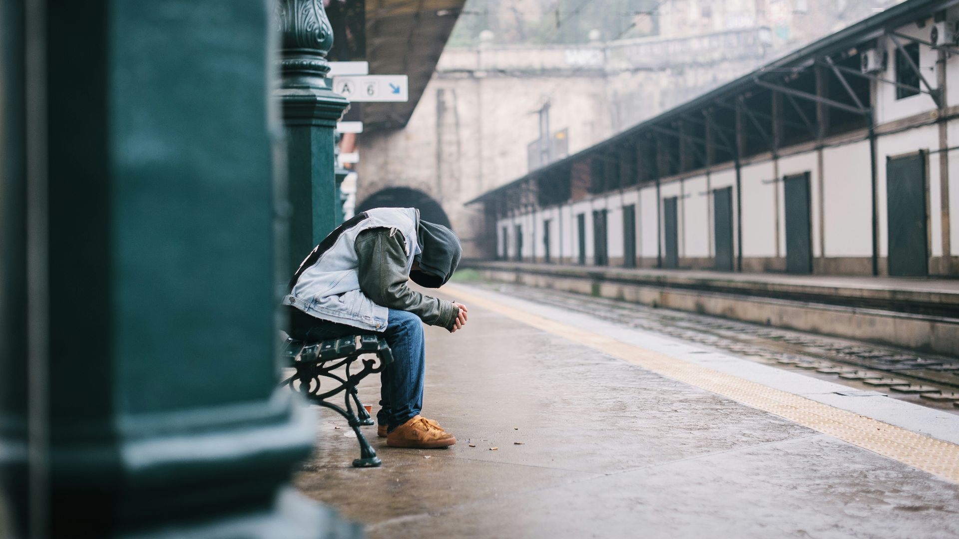 man sitting on bench