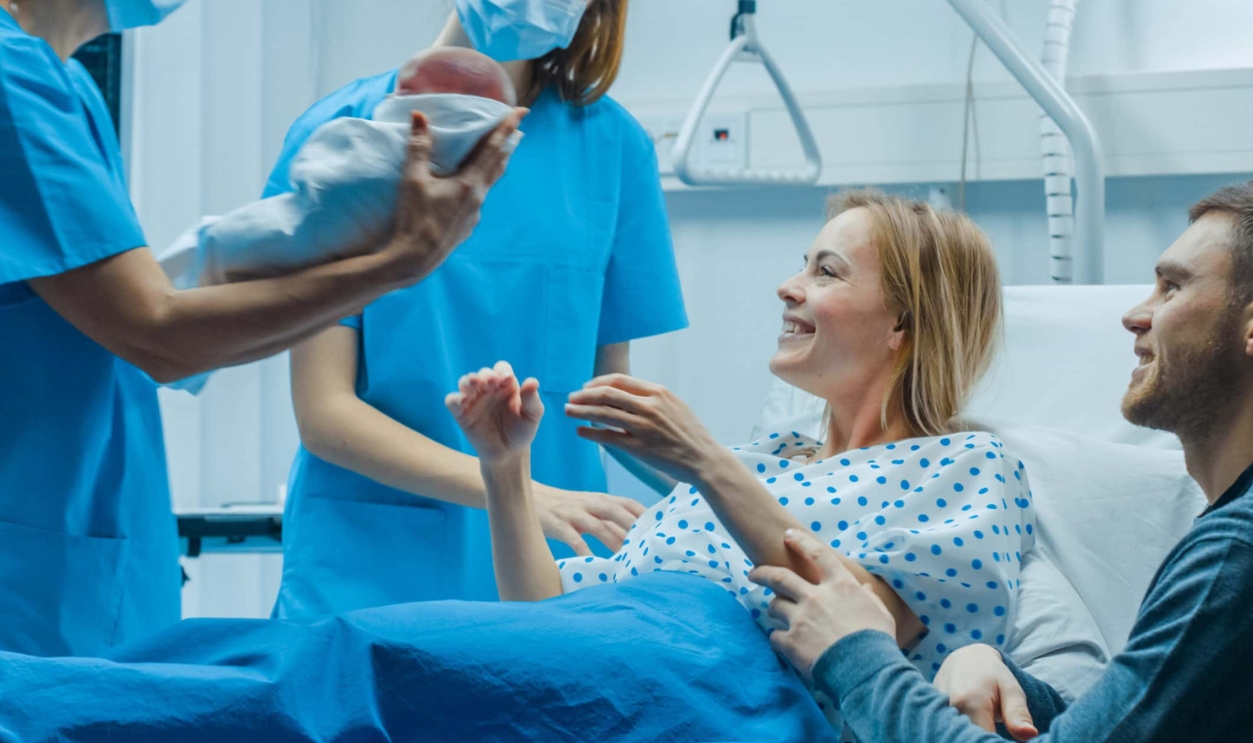 Midwife Gives Newborn Baby To A Mother, Shutterstock, 1181842981