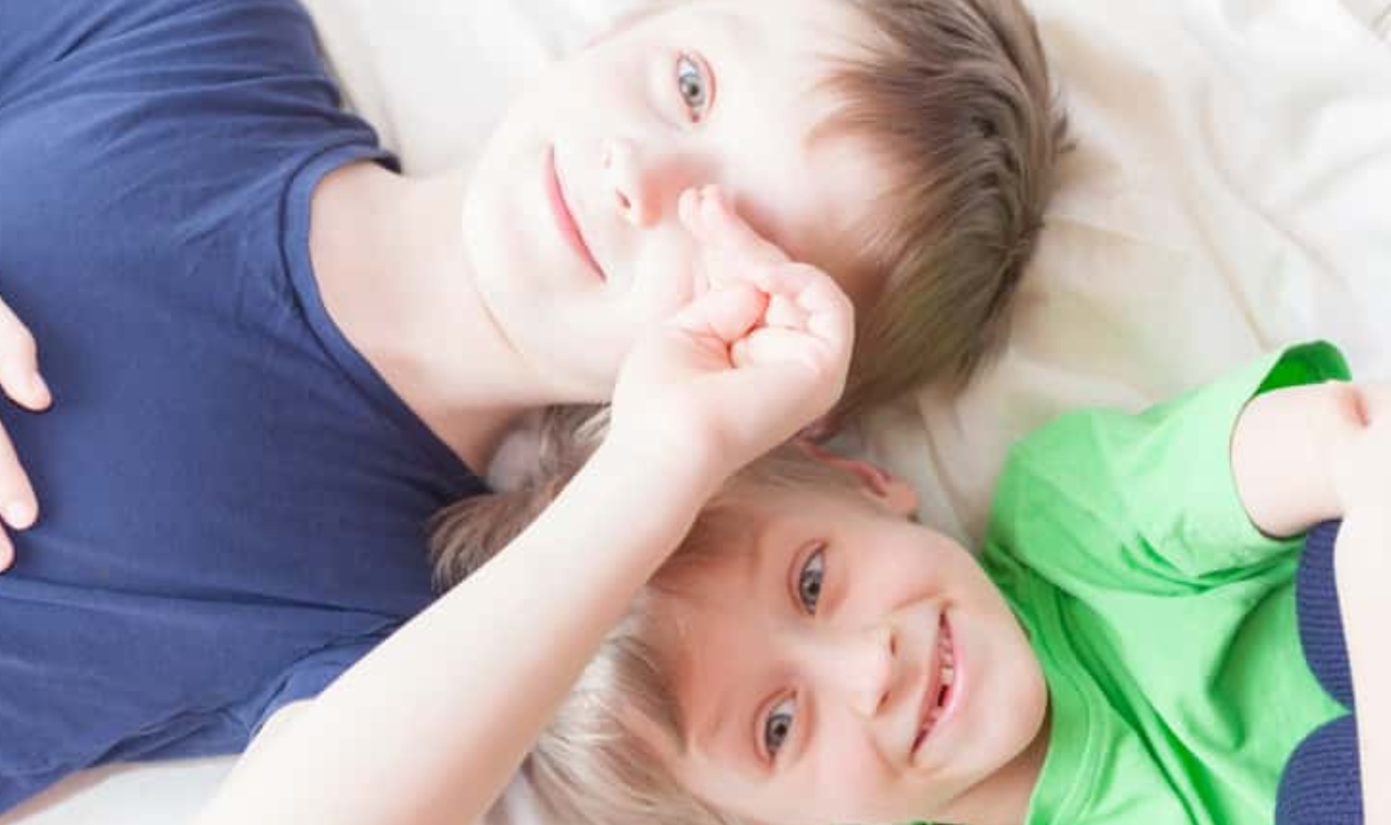 The Boys Are Lying On The Bed And Laughing, Shutterstock, 1692497599