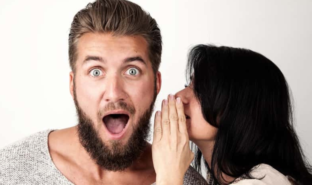 Woman Is Whispering A Secret Into Her Friends Ear, Shutterstock, 662471446