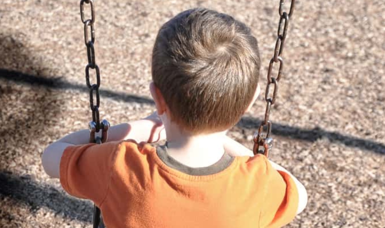Young Boy Is Sitting On A Swing Set, Shutterstock, 121428757