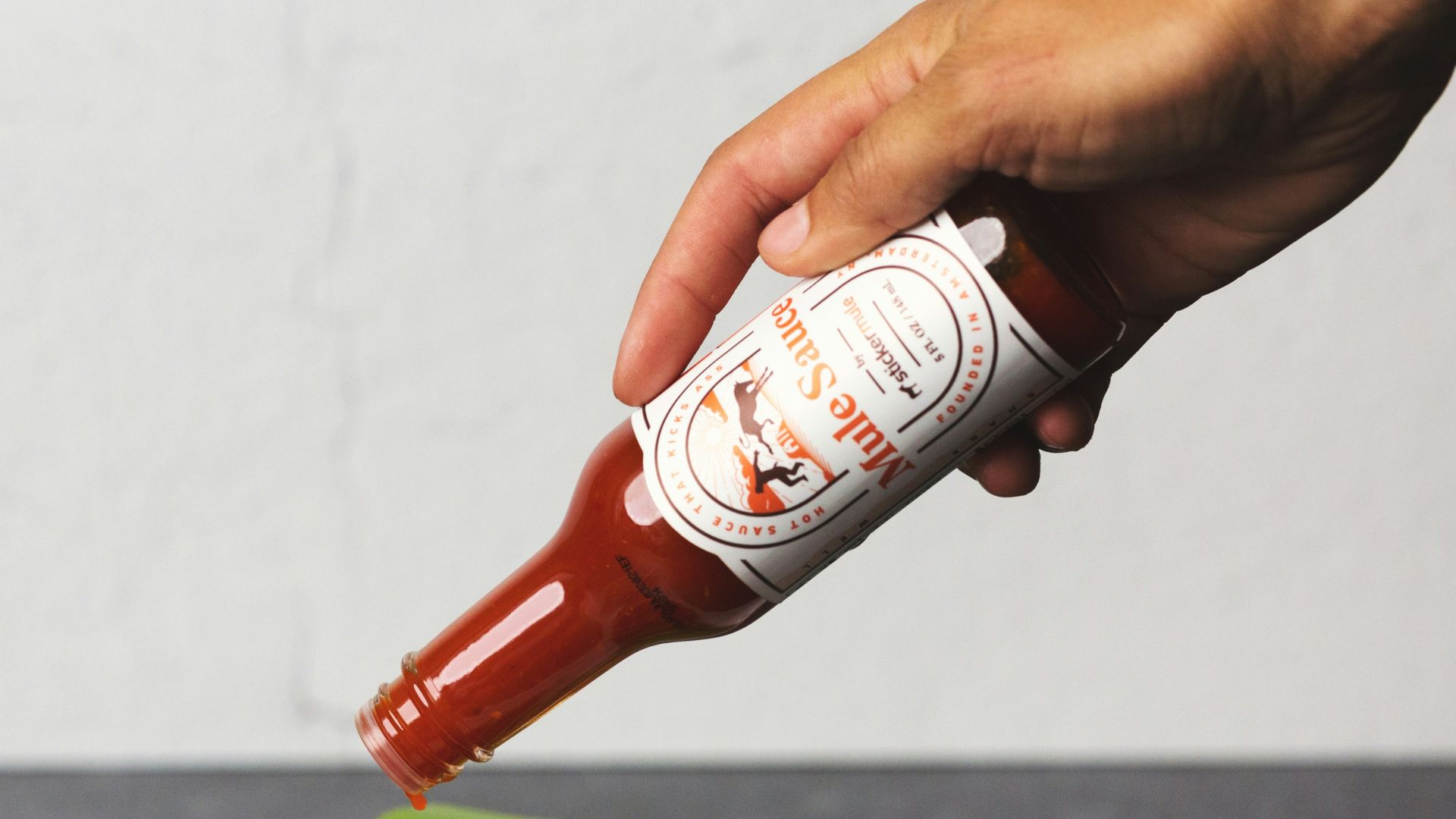 person holding white ceramic plate with food