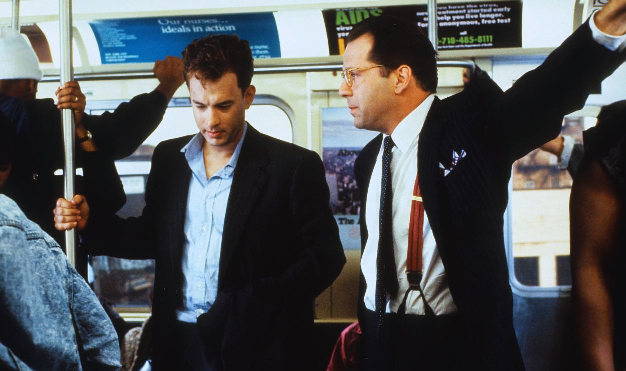 Tom Hanks and Bruce Willis riding the bus in a scene from the film 'The Bonfire of the Vanities', 1990. Blurred Background.