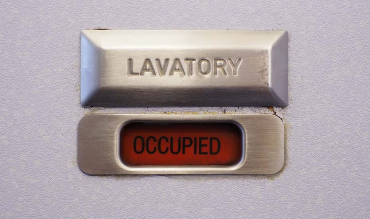 Occupied Lavatory Sign On The Commercial Airlines., Shutterstock, 520461745
