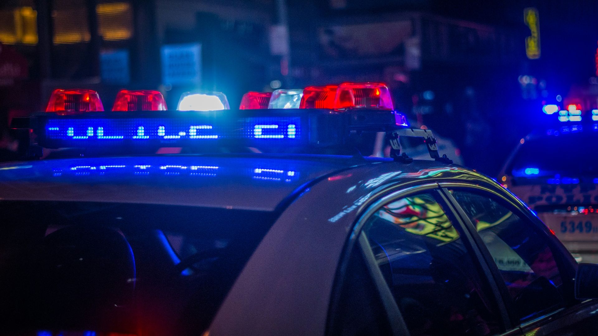 blue car on the street during night time