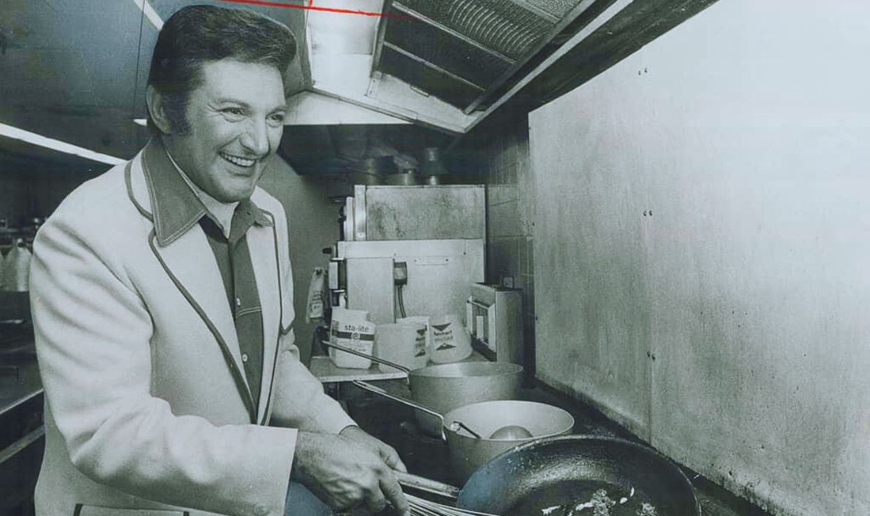 Gettyimages - 502334821, Liberace Demonstrates his cooking skill in the kitchen of O'Keefe Centre; where he has been performing this week. Liberace enjoys entertaining guests at his Palm Beach home and he has a large collection of recipes; which have been published recently in a cookbook; Liberace Cooks.