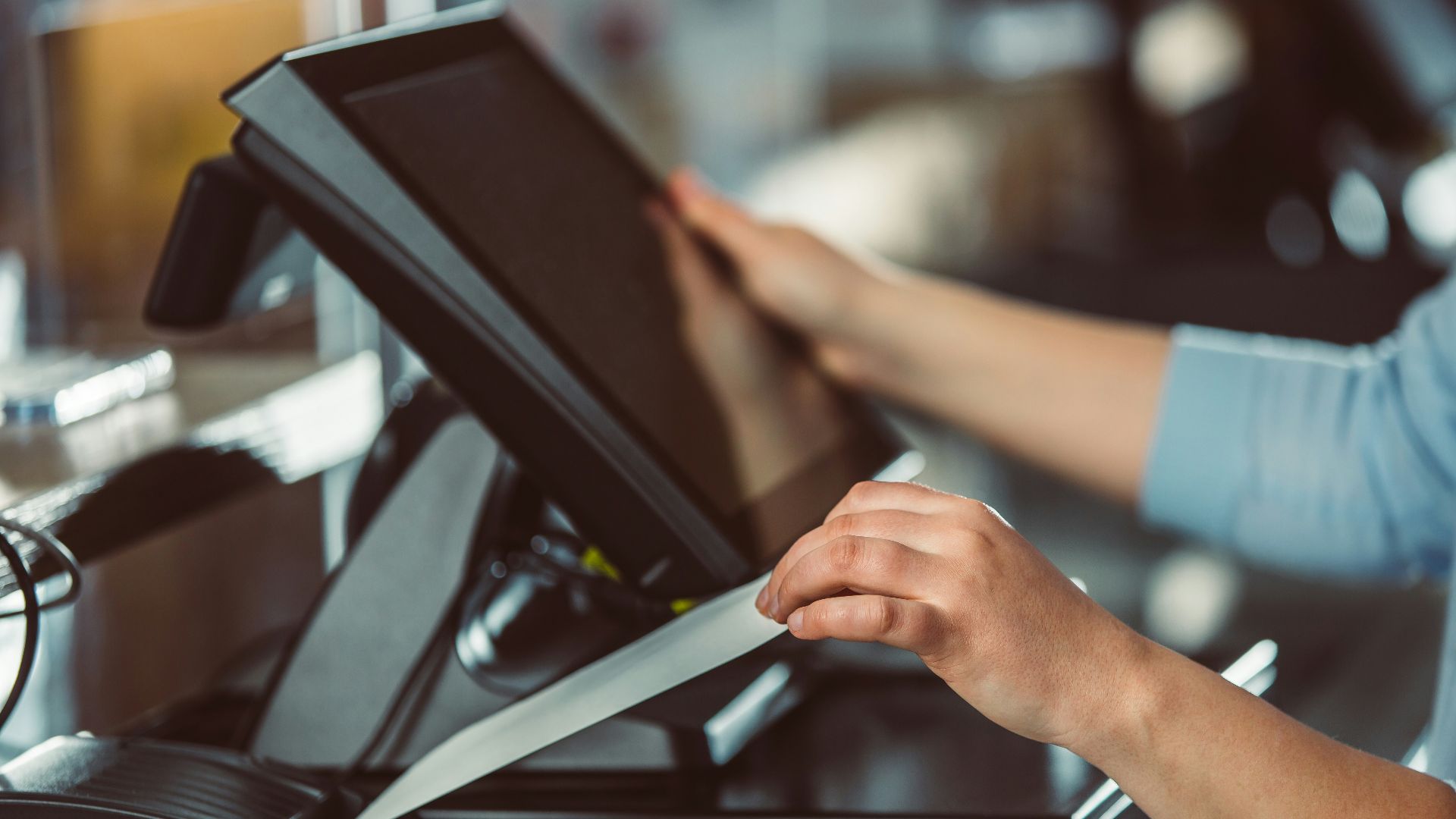a person is using a tablet on a conveyor belt