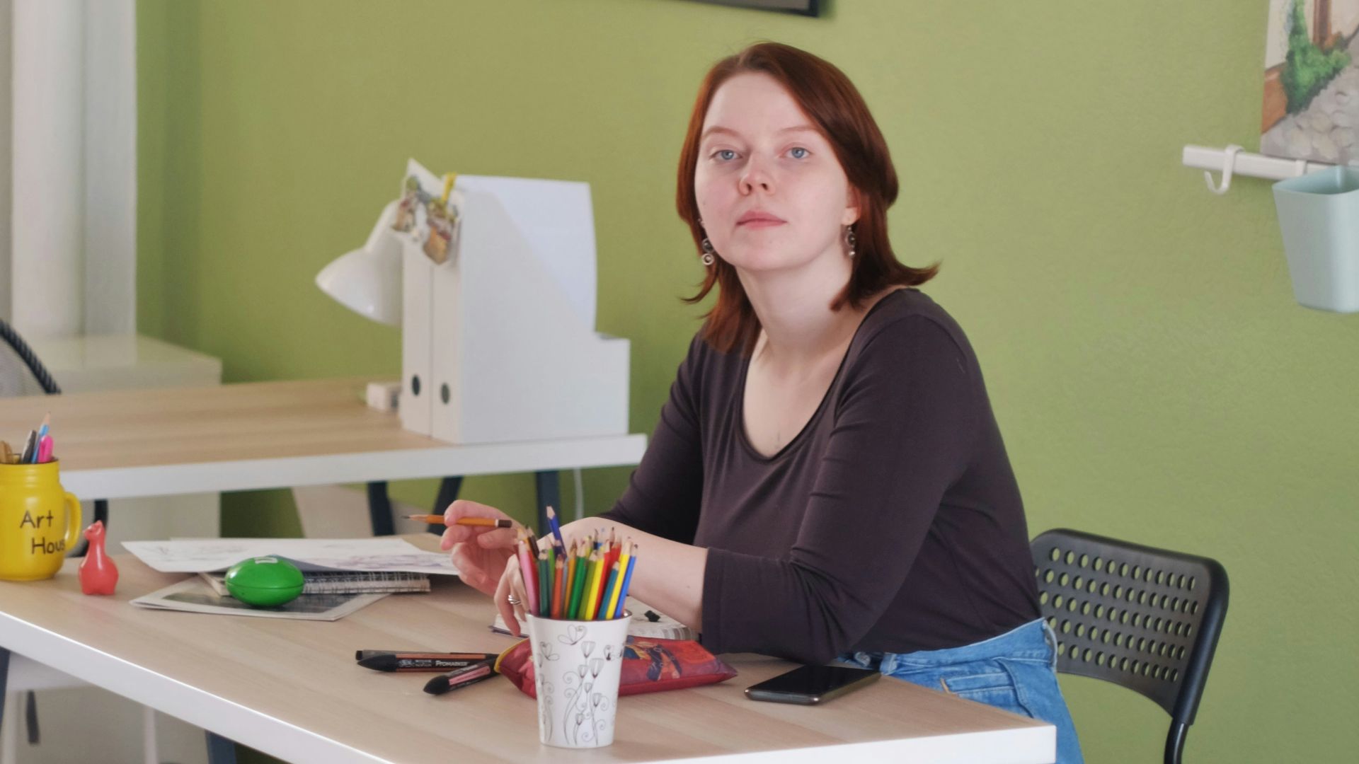 woman in black long sleeve shirt sitting on chair