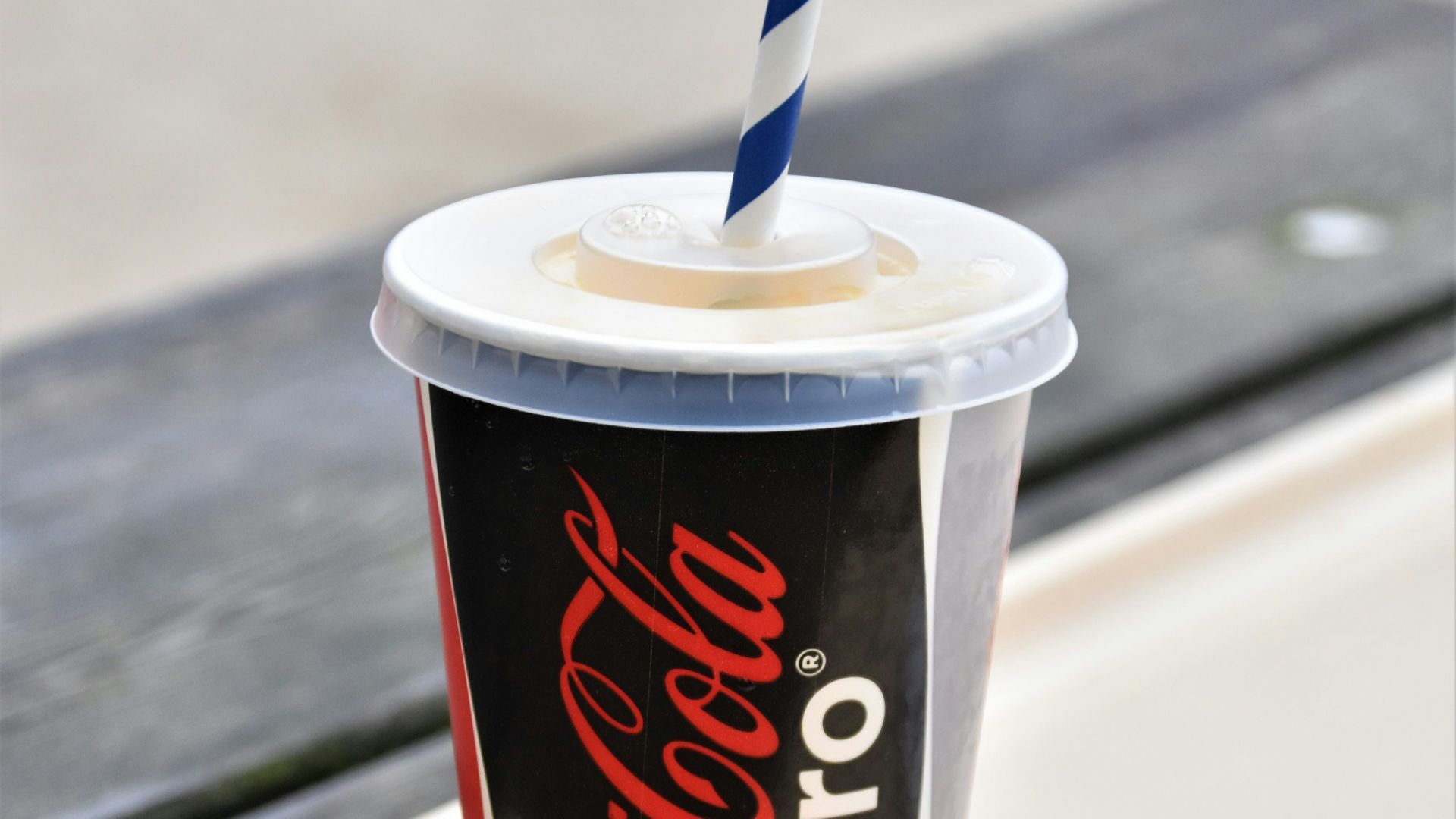 coca cola disposable cup with straw
