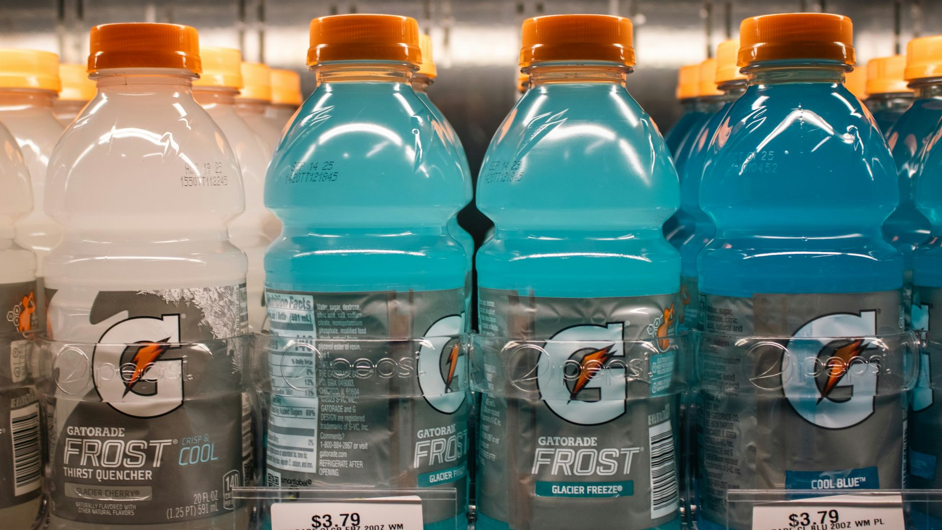 Gatorade frost bottles are displayed in a store.