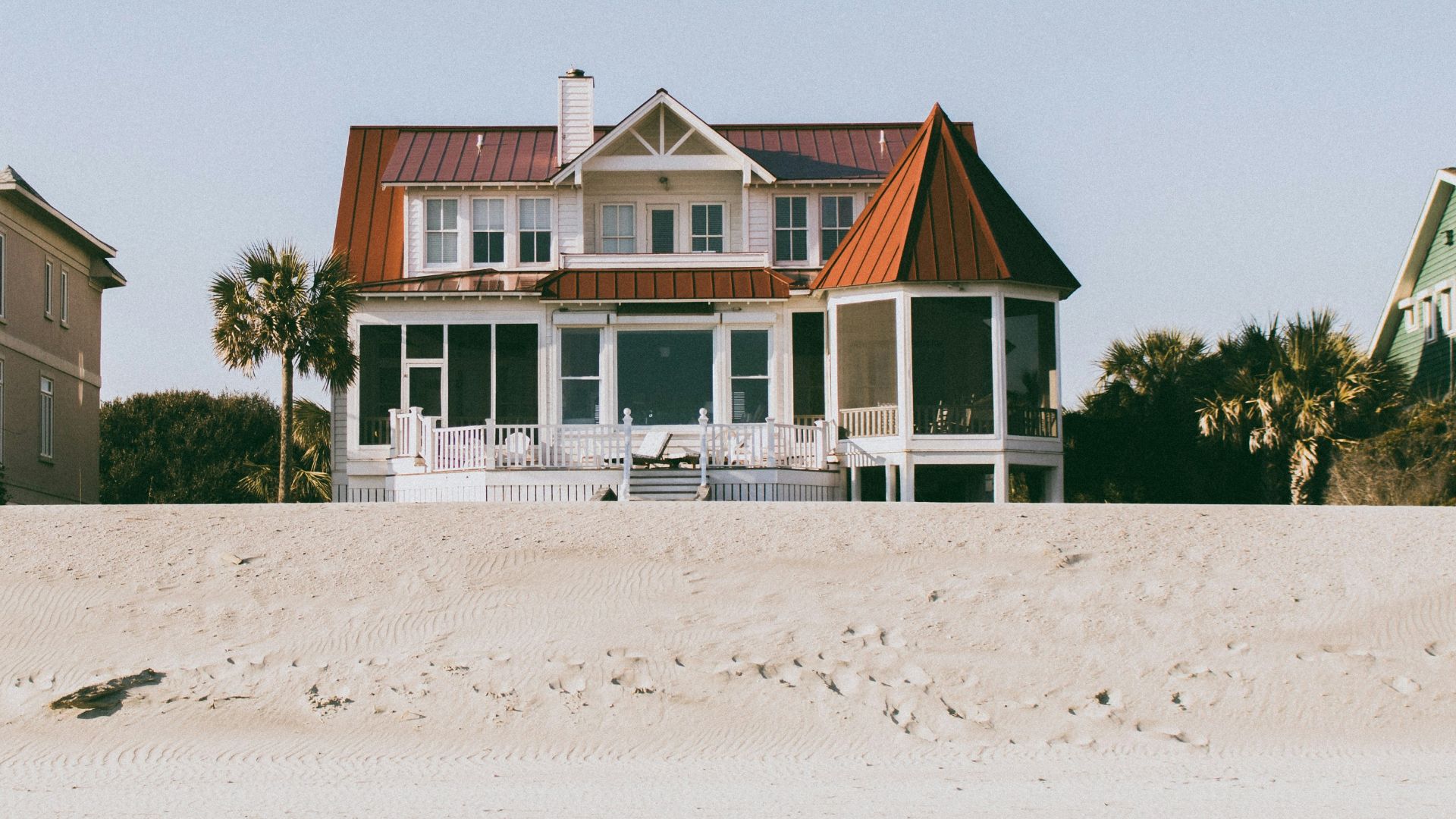 white and brown wooden 2-storey house